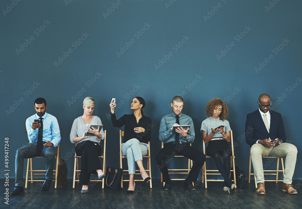 Leinwandbilder choose a network that wont let you down. shot of a group of business people using their smart device