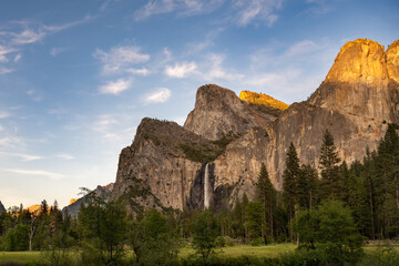 Fototapeta na wymiar Last light on Bridalveil Falls and Cathedral Spires, at Yosemite Valley View, in Yosemite National Park, near Merced, California.
