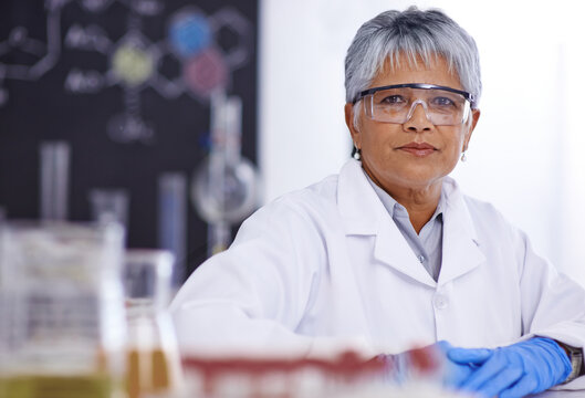 An Inspiring Woman Of Science. A Senior Female Scientist Working In Her Lab.