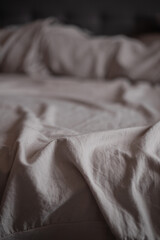 Black and white  morning bed sheets. Soft focus texture of the cotton fabric.Soft grey  fabric background.  Crumpled soft satin texture .