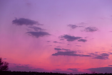 Pink and violet dramatic skyscape. Lavender blue colors of dark sunset  clouds. Beautiful peaceful sunset  landscape.