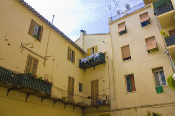 Fototapeta na wymiar Typical old courtyard of a building in Pesaro, Italy