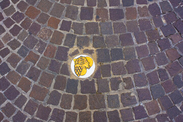 Pavement with a heart and an angel in Pesaro, Italy