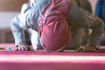 Muslim Arabic man praying. Religious muslim man praying inside the mosque during ramadan