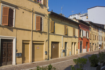 Fototapeta na wymiar Street with historical old buildings in downtown of Pesaro