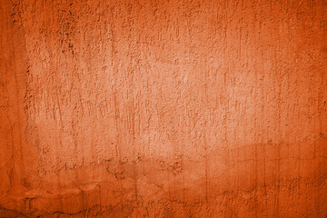 Orange abstract background or texture. Painted orange color stucco wall texture