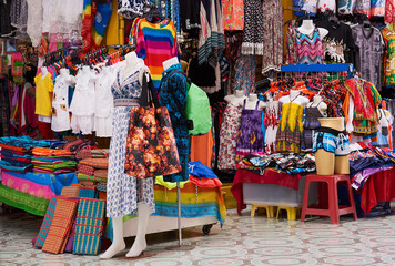 Pick and choose. Shot of a market stall selling clothes.