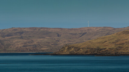 Landscape with the sea and a lonely wind turbine