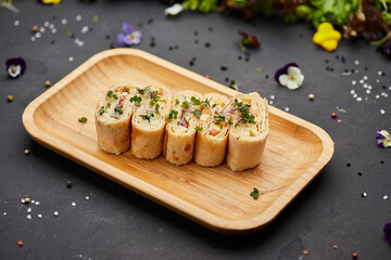 Snacks of pita bread with cheese and tomatoes. Variety mix of small sandwiches on dark background. Photo for restaurant menu