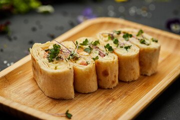 Snacks of pita bread with cheese and tomatoes. Variety mix of small sandwiches on dark background. Photo for restaurant menu