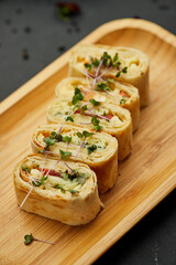 Snacks of pita bread with cheese and tomatoes. Variety mix of small sandwiches on dark background. Photo for restaurant menu
