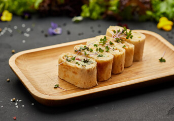 Snacks of pita bread with cheese and tomatoes. Variety mix of small sandwiches on dark background. Photo for restaurant menu