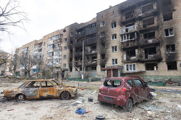 Irpen city, Ukraine, April 11, 2022. War of Russia against Ukraine. Burnt-out car against the...