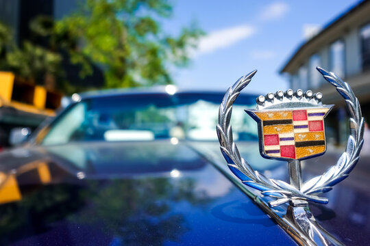 Abano Terme, Italy - 16 April 2022: luxury Cadillac logo hood ornament on a blue cabriolet car