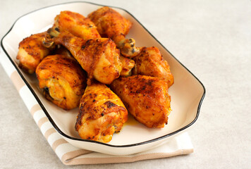 Roast chicken drumsticks on plate