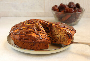Date and nut cake with chocolate glaze