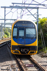 Naklejka premium Commuter train approaching a train station in Sydney NSW Australia