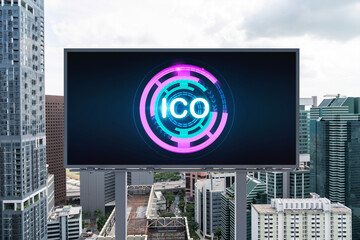 ICO hologram icon on billboard over panorama city view of Singapore at day time. The hub of blockchain projects in Southeast Asia. The concept of initial coin offering, decentralized finance