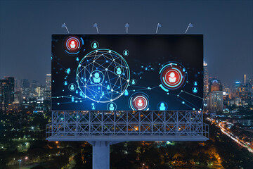 Glowing Social media icons on billboard over night panoramic city view of Bangkok. The concept of networking and establishing new connections between people and businesses in Southeast Asia