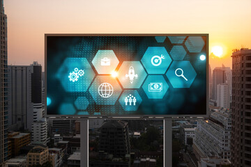 Hologram of Research and Development glowing icons on billboard. Sunset panoramic city view of...