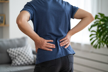 Back pain, kidney inflammation, man suffering from backache at home - obrazy, fototapety, plakaty