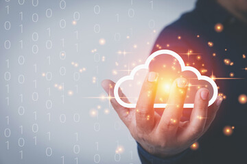Businessman holding virtual clouds computing to transfer data information and upload or download database corporate with copy space. Technology transformation databases concept.