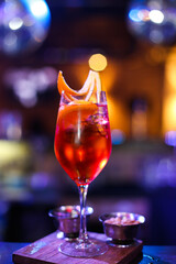One alcoholic cocktail Aperol Spritz in a nightclub