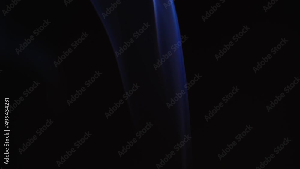 Poster abstract blue color smoke with a black background in slow motion. realistic cloud smoke with a strea