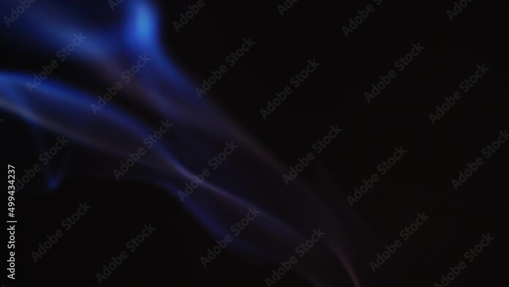 Poster abstract blue color smoke with a black background in slow motion. realistic cloud smoke with a strea