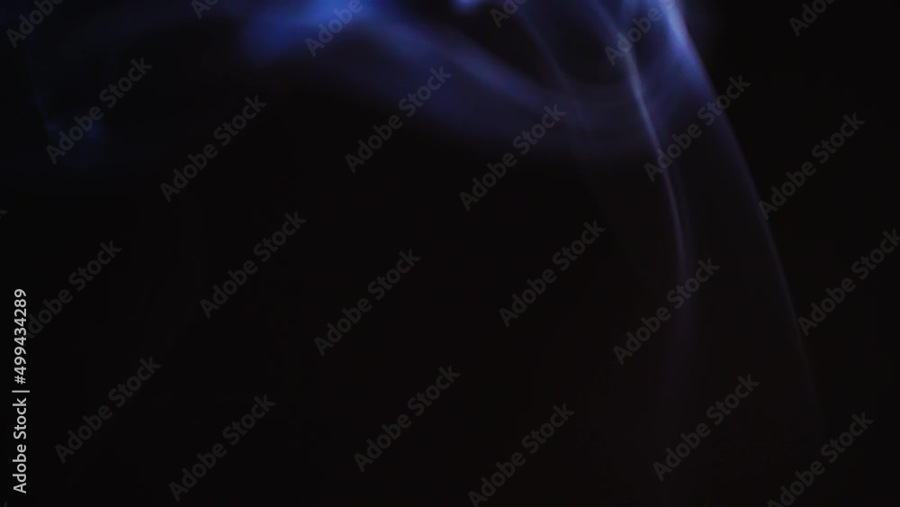 Poster abstract blue color smoke with a black background in slow motion. realistic cloud smoke with a strea