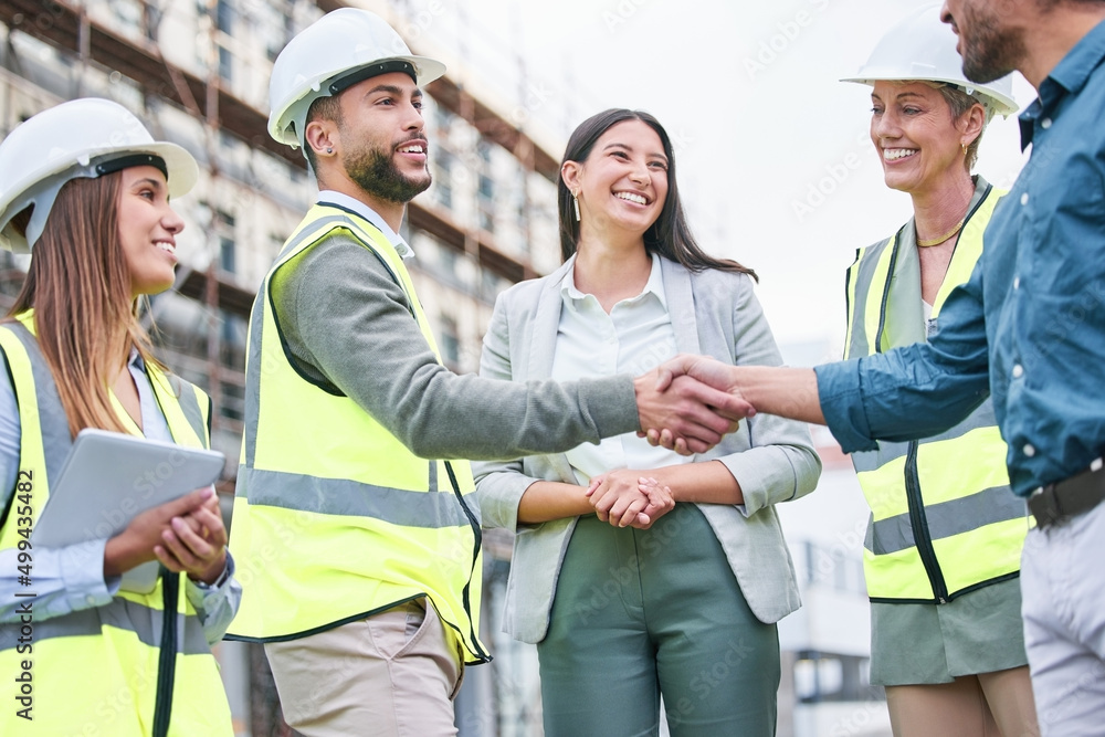 Poster when we strive to become better than we are. shot of a team of builders shaking hands on a construct