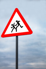 road sign Attention children on sky background