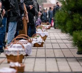 people with food basket waiting for easter blessing