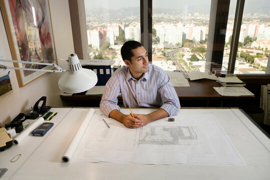 Architect sitting at draft table