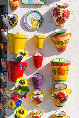 Colorful, ceramic flowerpots exposed for sale in Frigiliana, Spain