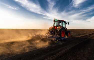 Farmer preparing his field in a tractor
