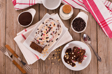 Sponge cake with white frosting and sugars.
