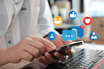 Social media and digital online concept, man using smart phone at home. The concept of living on vacation and playing social media. Modern graphic interface showing online social connection network