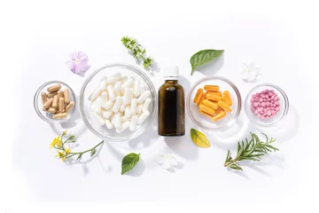 Poster Flat lay composition of various vitamin capsules and dietary supplements isolated on white background. Vitamin complexes concept. © Miguel Tamayo 