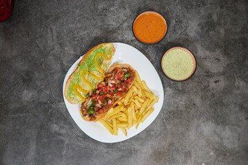 assorted of mexican food with fajitas, chili con carne and nachos with avocado, beef and cheese