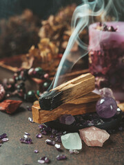 Palo Santo, holy sacred tree stick, burning with aroma smoke. Esoteric life balance, good energy concept. Healing energy with crystals and smoke.