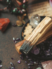 Palo Santo, holy sacred tree stick, burning with aroma smoke. Esoteric life balance, good energy concept. Healing energy with crystals and smoke.