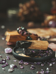 Palo Santo, holy sacred tree stick, burning with aroma smoke. Esoteric life balance, good energy concept. Healing energy with crystals and smoke.
