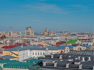 Obraz premium Magical view from the Spasskaya Tower of the Kazan Kremlin. Rooftops of Kazan. View of the city center. A variety of buildings and landmarks.