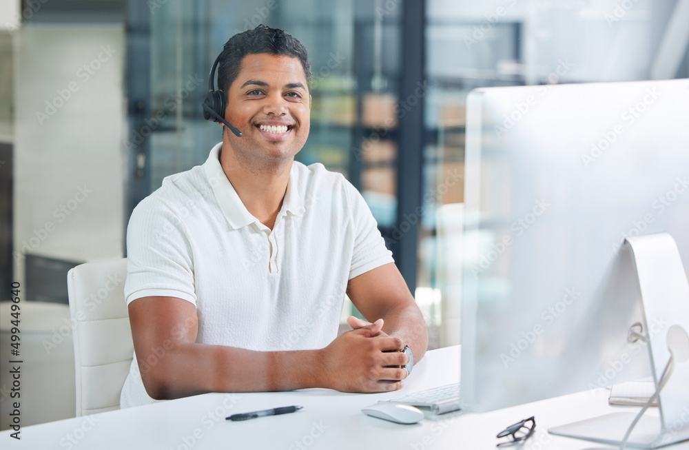 Aufkleber ready to be of assistance. shot of a handsome young businessman sitting alone in his office and wear