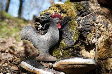 Wooden rooster decoration. Photographed in the wild.