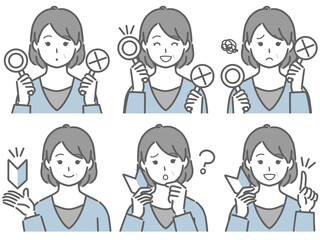 〇✕マークや初心者マークを持つ中年女性