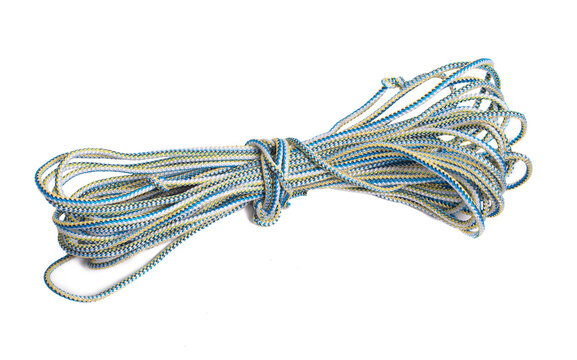 Universal polypropylene rope isolated onwhite background. A coil of new colored rope.
