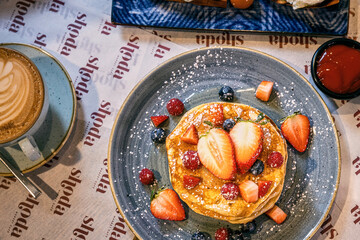 College of Breakfast Assortiment with pancakes, eggs, coffee 