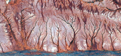 abstract landscape of the deserts of Africa from the air emulating the shapes and colors of the...